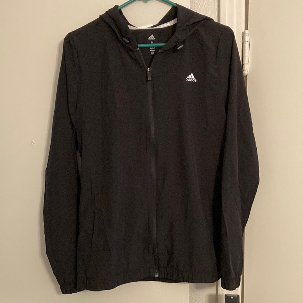 Adidas women’s wind jacket with hood. Color black. size medium. New with tags